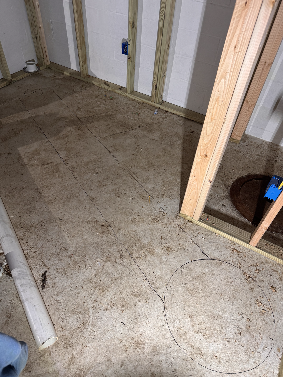 Marking locations for toilet flange and sewer ejector basin