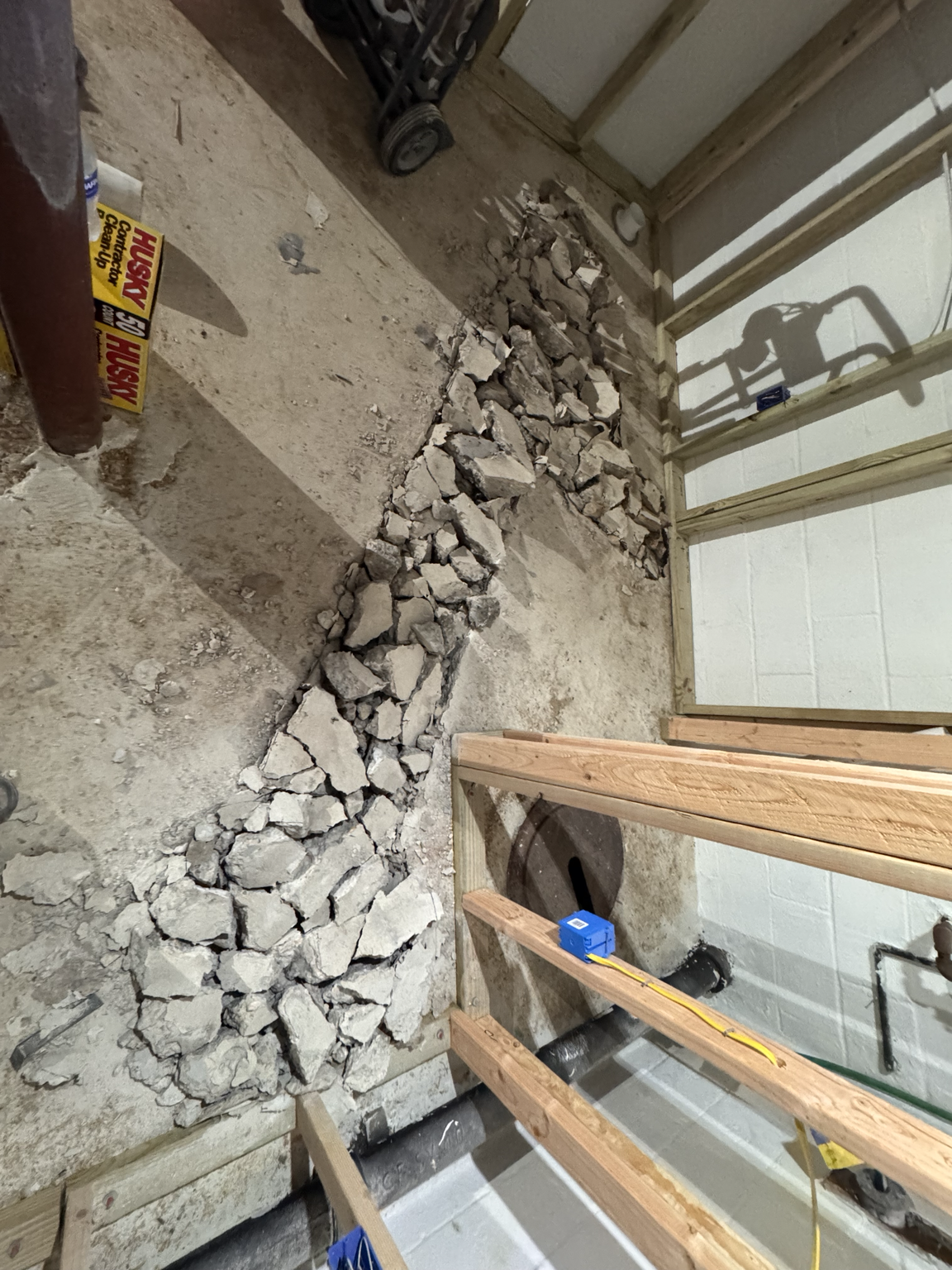 Breaking slab and trenching for new drain lines