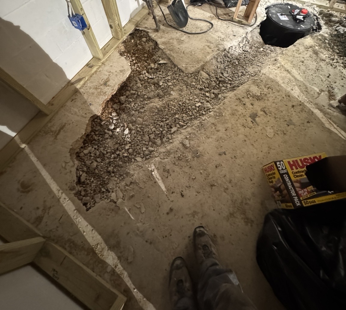 Excavation for sewer ejector basin and discharge routing