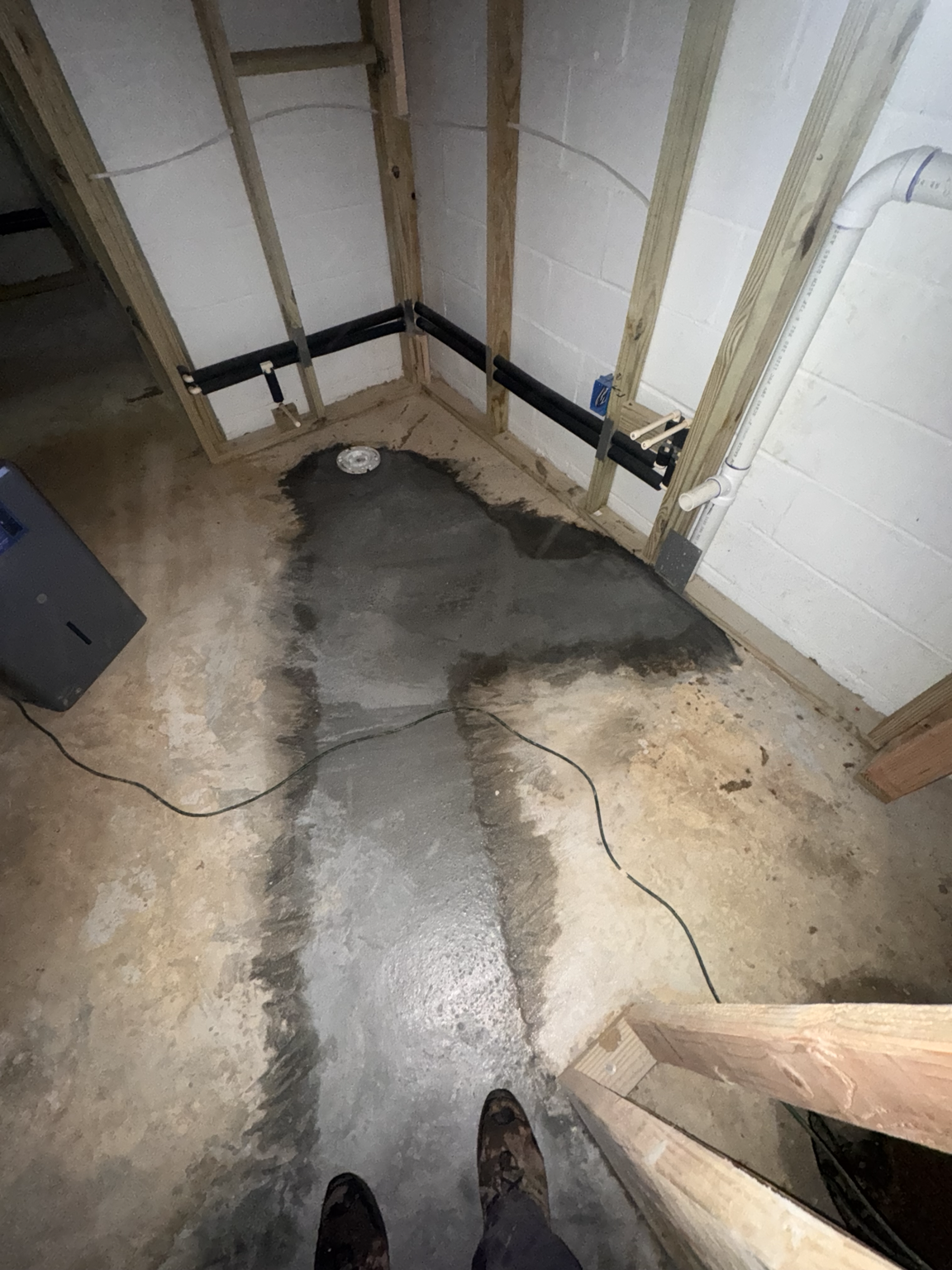 Installing drain piping and tying into ejector system