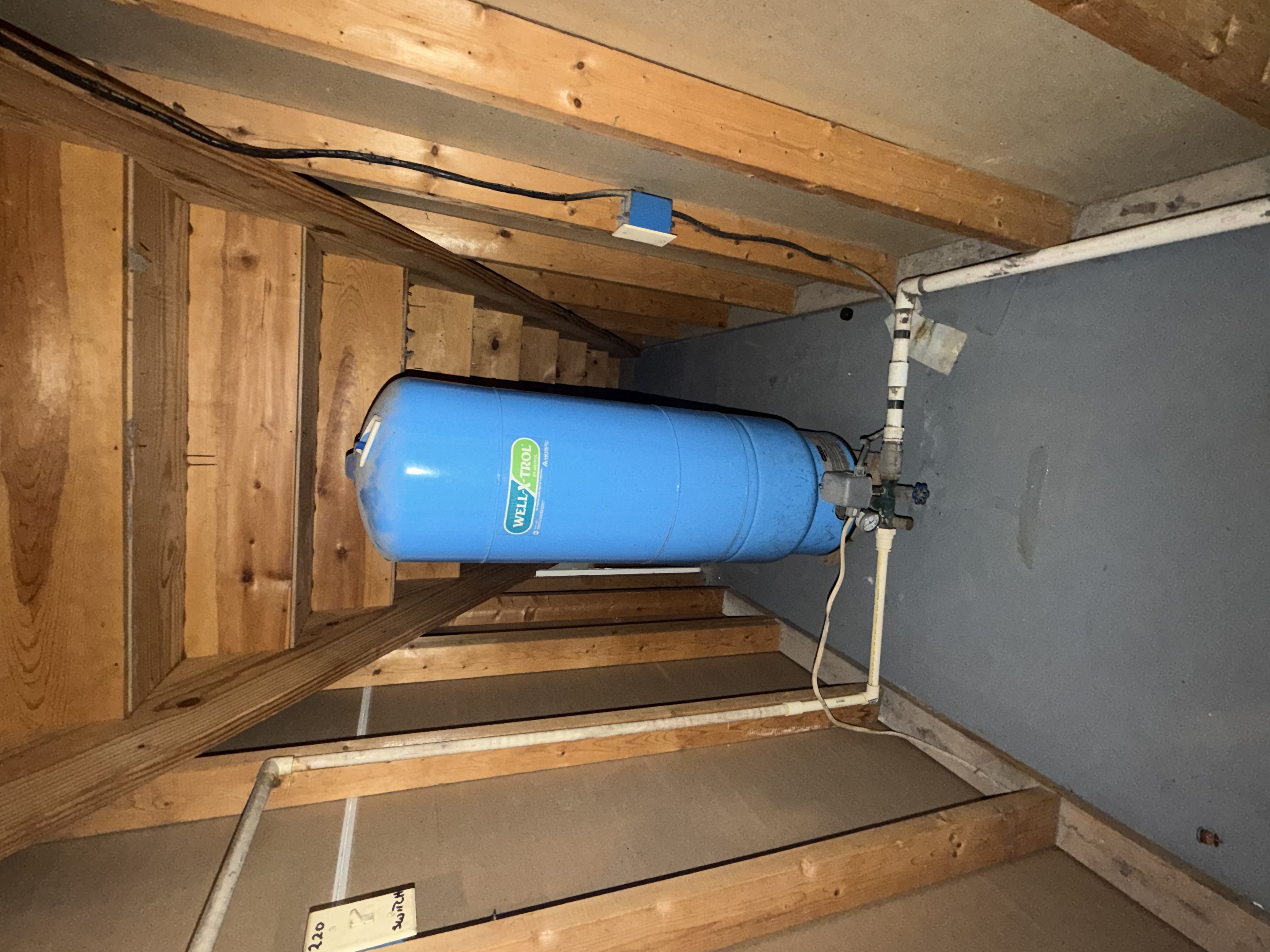 Existing well pressure tank before replacement